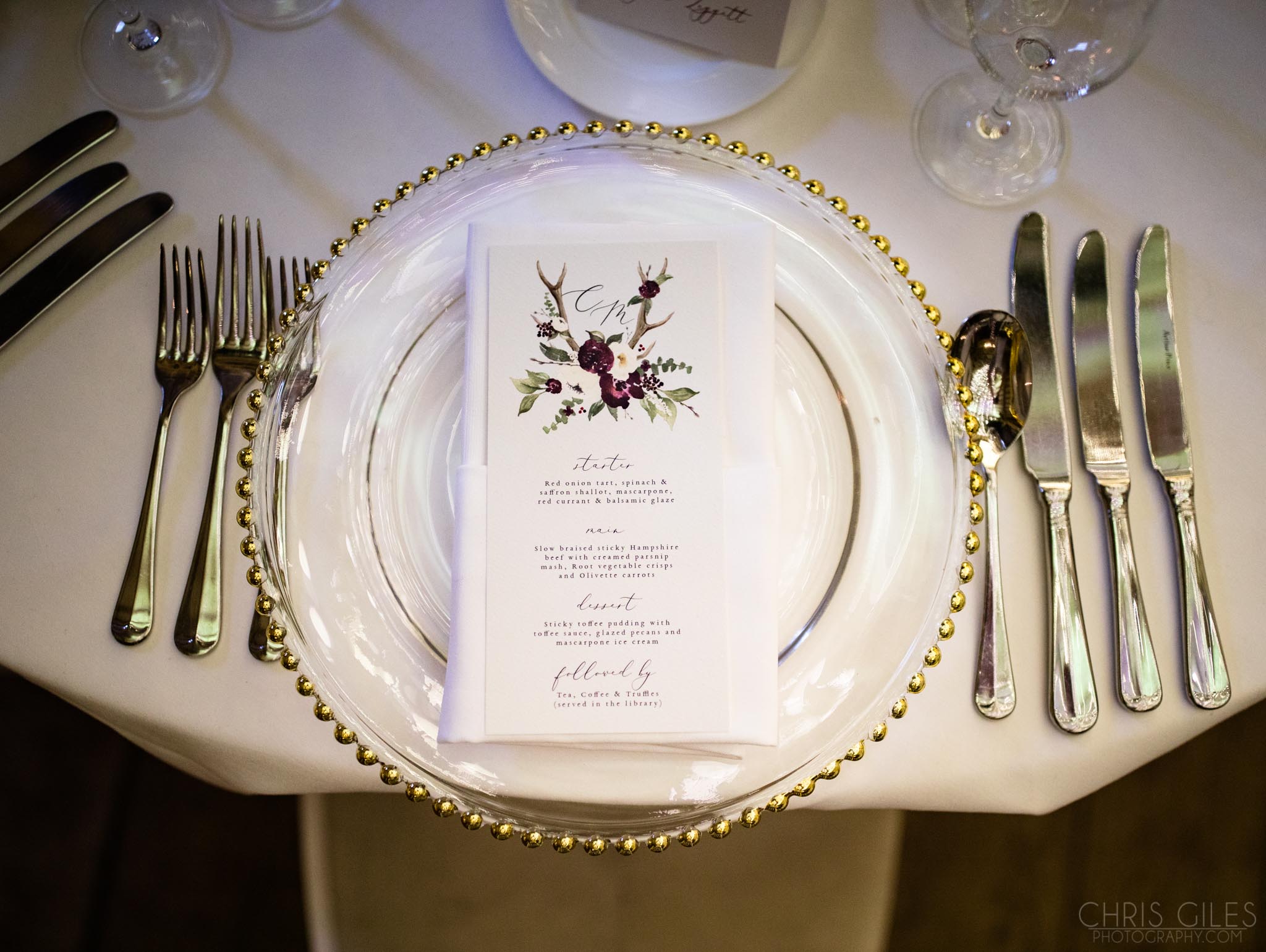 Gold rimmed cutlery and crockery for a wedding