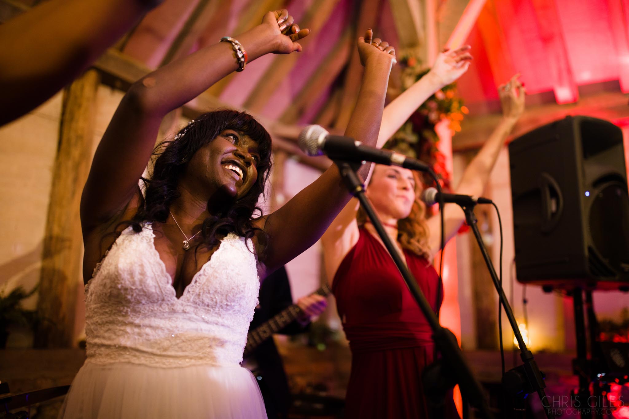 Bride singing at her own wedding at Templars Wedding Barn in Berkshire
