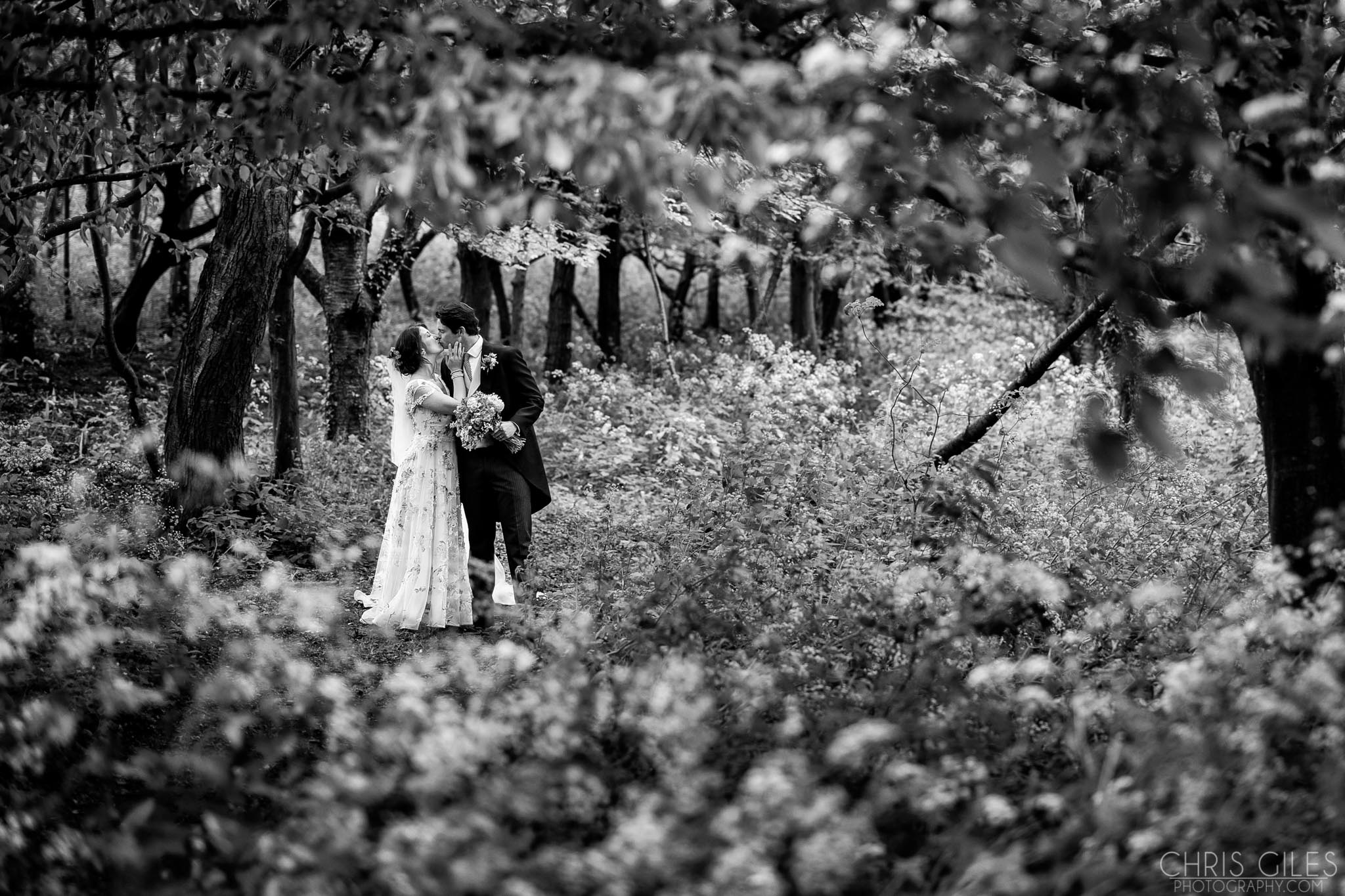 Summer wedding photo in the woodland at Cripps Barn
